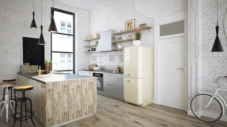 Eine minimalistisch eingerichtete weiße Küche mit hellen Holzvertäfelungen an den Seiten, fotografiert aus einer Ecke des Raumes auf Hüfthöhe